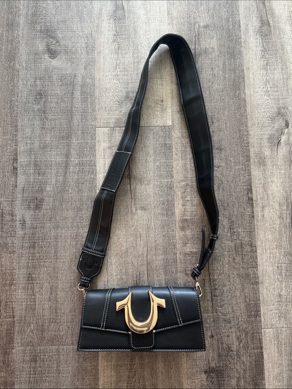 True Religion Black Crossbody Bag with Gold Horseshoe Accent